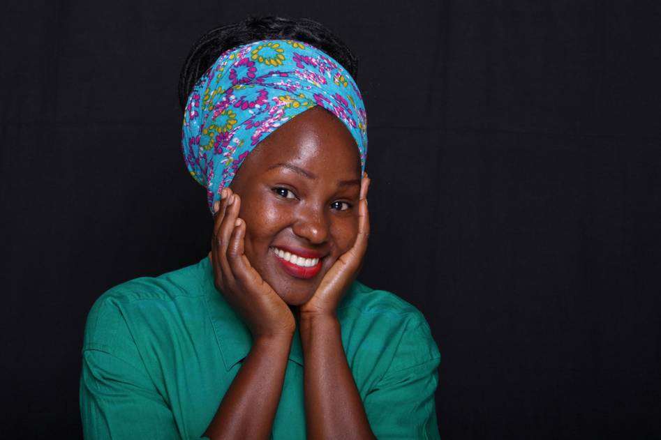 Collection of colorful fabric hair wraps laid on a wooden surface