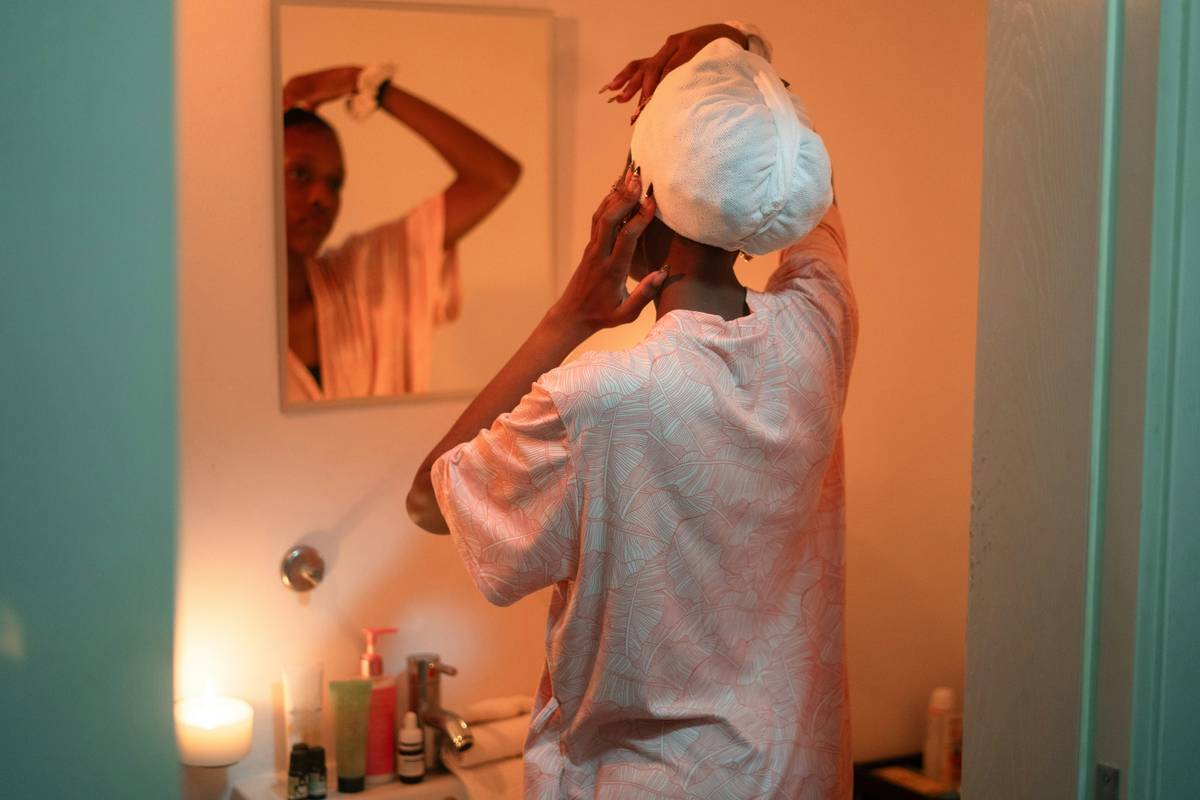 Woman demonstrating proper Head Wraps technique with bamboo fabric